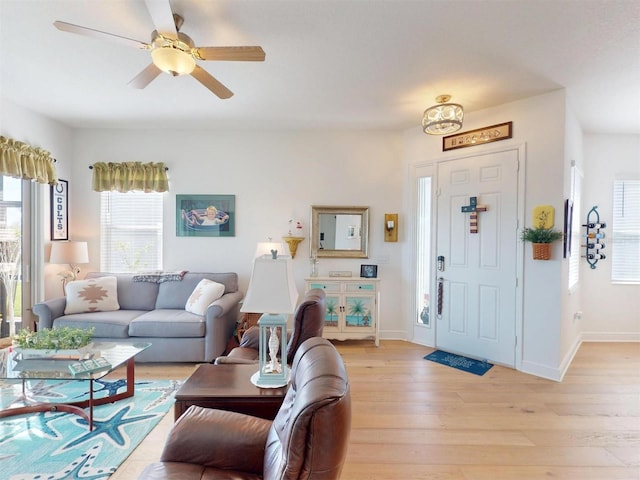 24313 Westgate Blvd, Punta Gorda, FL 33980 - living area with light wood-style floors, baseboards, and ceiling fan