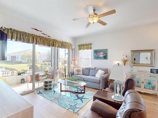 24313 Westgate Blvd, Punta Gorda, FL 33980 - living area with light wood-style floors and a ceiling fan