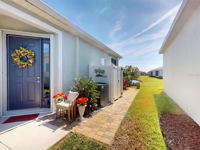 24313 Westgate Blvd, Punta Gorda, FL 33980 - view of green lawn featuring central air condition unit