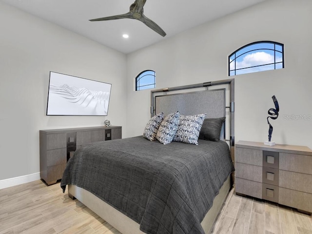 bedroom featuring ceiling fan and light hardwood / wood-style flooring