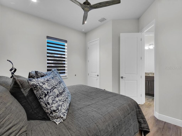 bedroom with hardwood / wood-style floors and ceiling fan