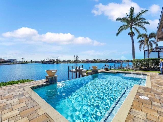 view of swimming pool with a water view, a dock, and pool water feature