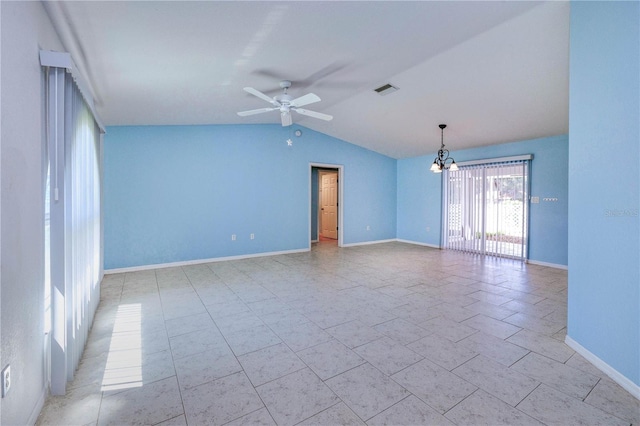 unfurnished room featuring vaulted ceiling, ceiling fan with notable chandelier, baseboards, and visible vents