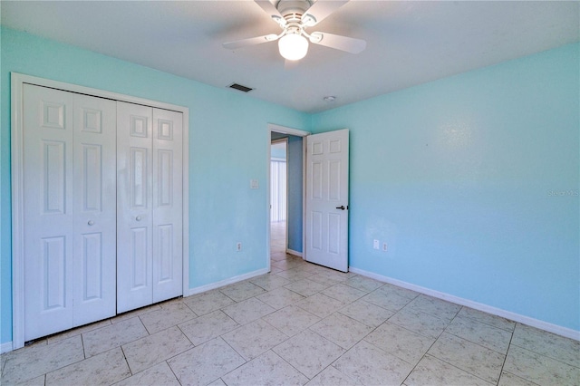 unfurnished bedroom with baseboards, visible vents, a closet, and a ceiling fan