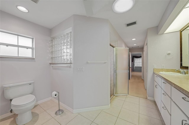 full bath with tile patterned flooring, vanity, visible vents, and a shower stall