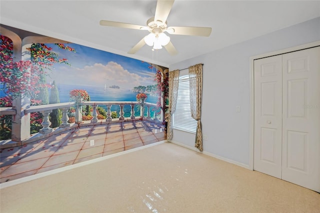 carpeted bedroom with ceiling fan and baseboards