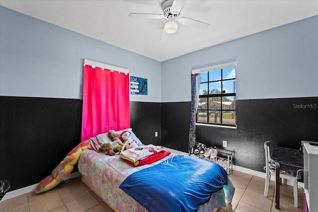 tiled bedroom with ceiling fan