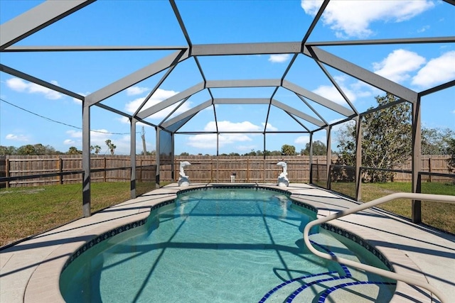 view of pool featuring a lanai and a lawn