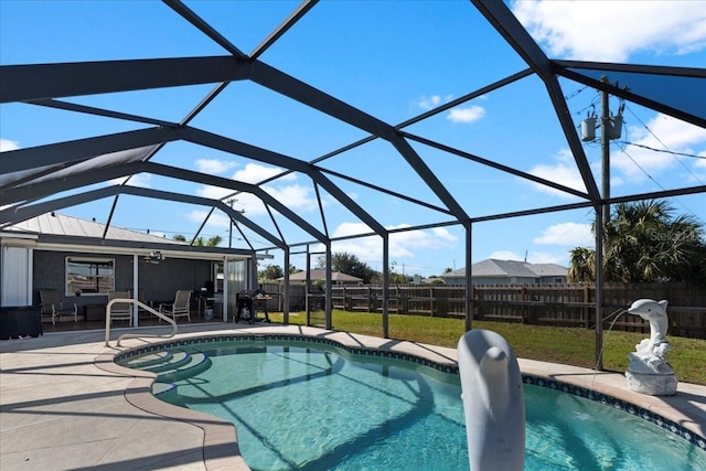 view of pool with a lanai and a patio