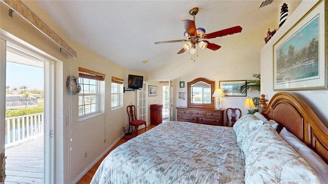 bedroom featuring baseboards, visible vents, lofted ceiling, wood finished floors, and access to exterior