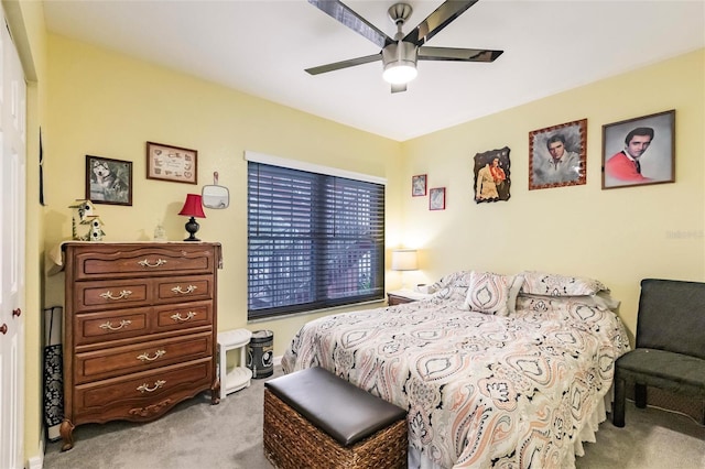 bedroom with light carpet and ceiling fan