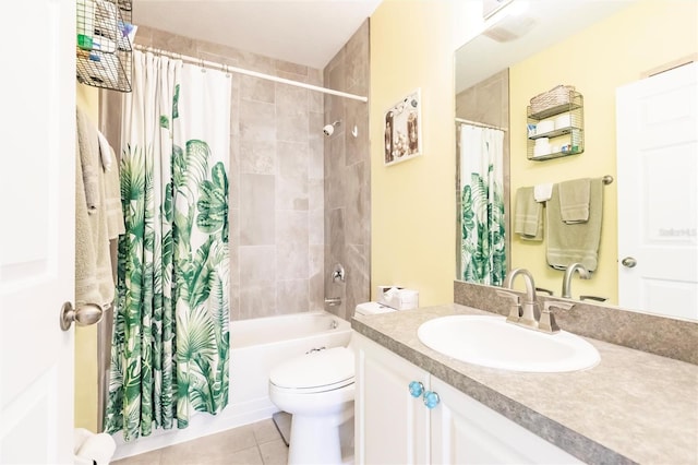 full bathroom featuring toilet, tile patterned flooring, shower / tub combo with curtain, and vanity