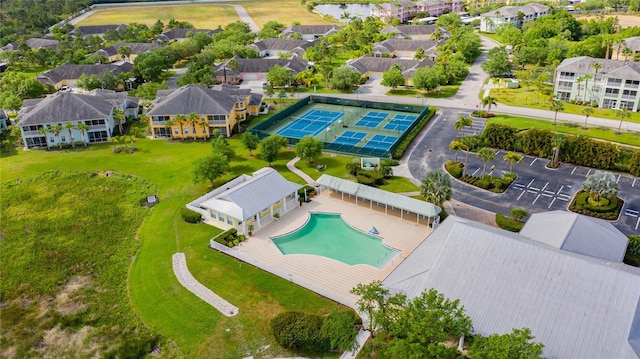 birds eye view of property with a residential view