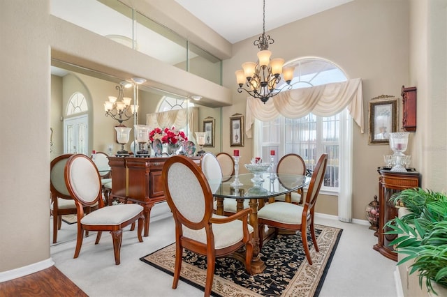 dining space featuring beam ceiling, baseboards, and a notable chandelier