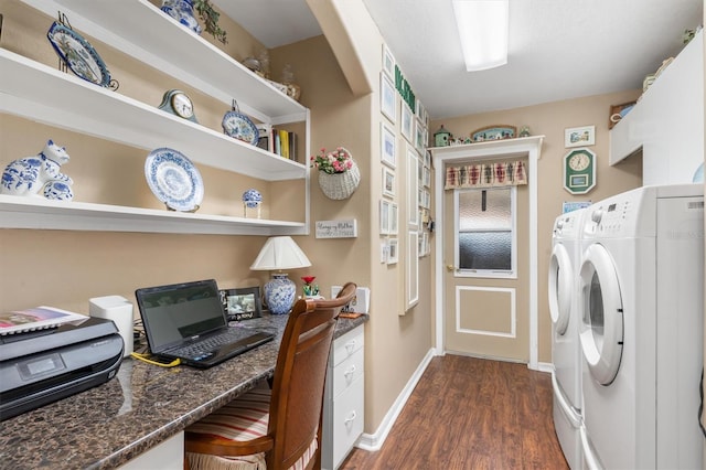 clothes washing area featuring dark wood-style floors, laundry area, baseboards, and washing machine and clothes dryer