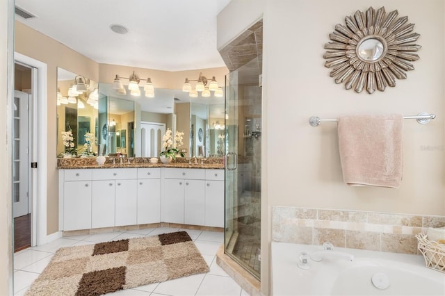 bathroom with a shower stall, visible vents, tile patterned flooring, and vanity