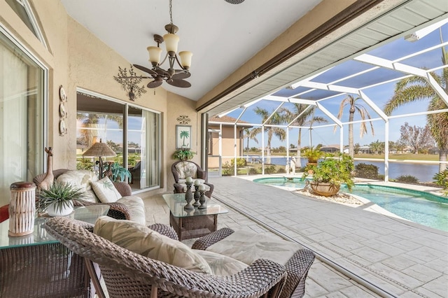 sunroom / solarium with a water view and vaulted ceiling