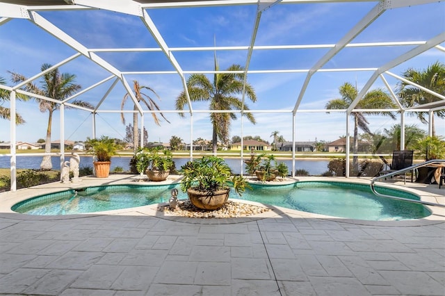 pool featuring a patio area, a water view, and a lanai