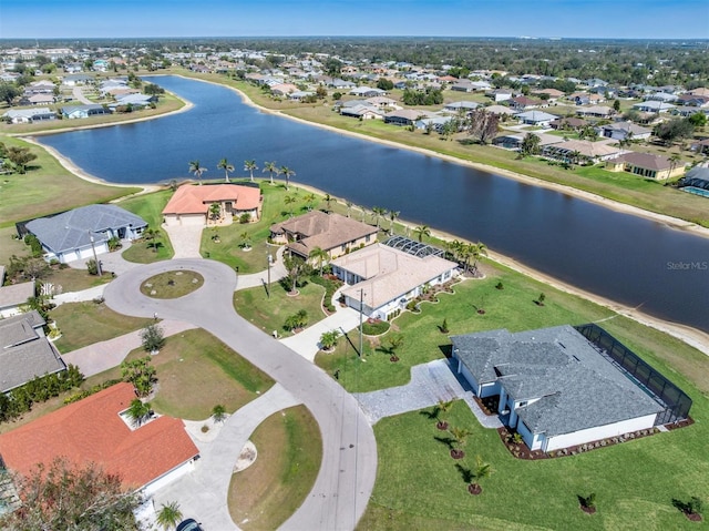 drone / aerial view featuring a water view and a residential view