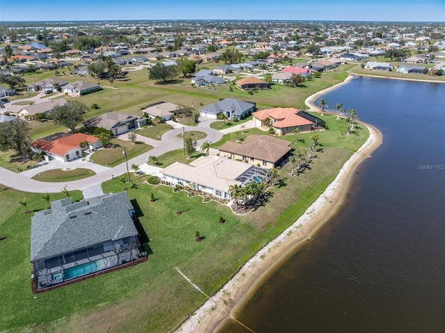 birds eye view of property featuring a water view and a residential view