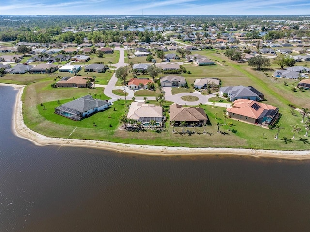 birds eye view of property featuring a residential view and a water view