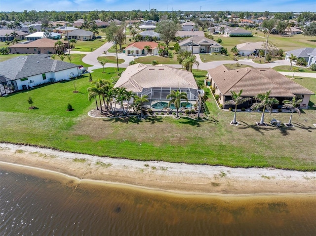 birds eye view of property featuring a residential view and a water view