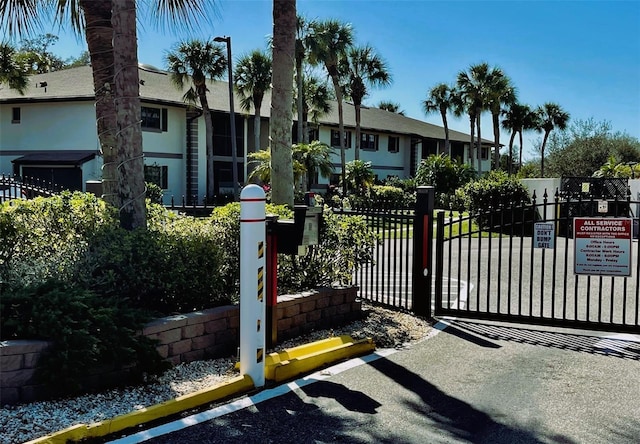 view of gate with a residential view