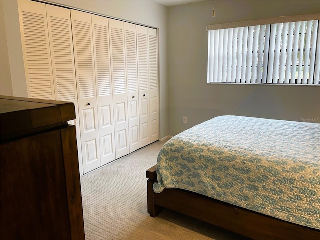 carpeted bedroom with a closet