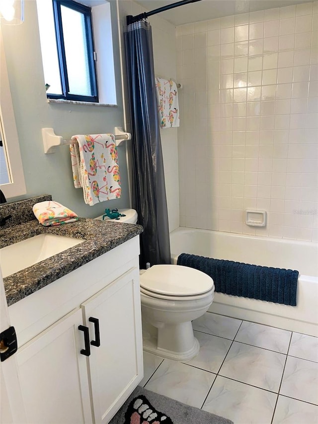 full bath featuring shower / bath combo, vanity, and toilet