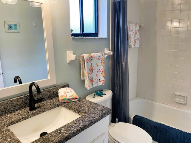 full bathroom with shower / bathtub combination with curtain, vanity, and toilet