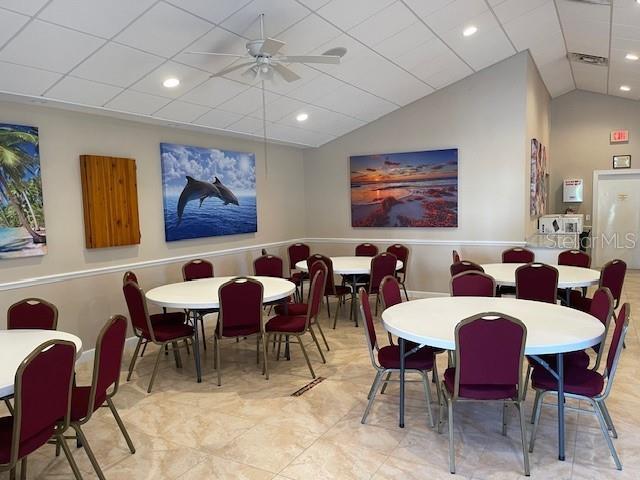 dining room with ceiling fan, lofted ceiling, and recessed lighting