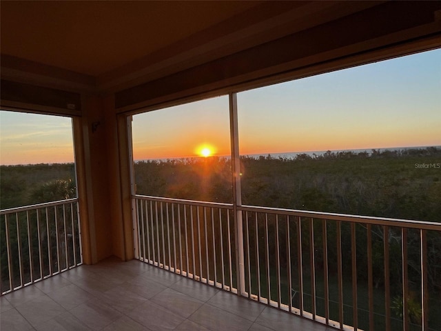 balcony at dusk with a water view