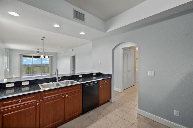 kitchen featuring visible vents, light tile patterned flooring, arched walkways, a sink, and dishwasher