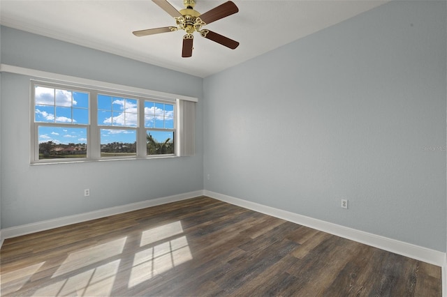 unfurnished room featuring a ceiling fan, baseboards, and wood finished floors