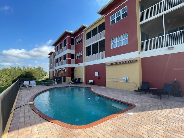 community pool featuring a patio area
