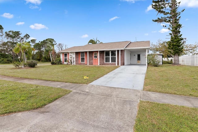 single story home with a front yard and a carport