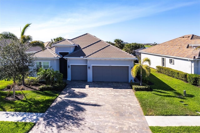 ranch-style house with a front lawn and a garage