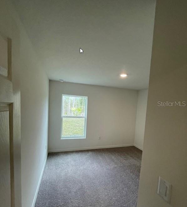 363 Underwood Trl, Palm Coast, FL 32164 - empty room featuring baseboards and carpet flooring