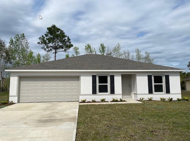 363 Underwood Trl, Palm Coast, FL 32164 - ranch-style home with stucco siding, an attached garage, concrete driveway, and a front yard