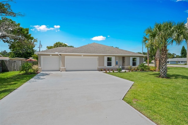 ranch-style house with a garage and a front yard