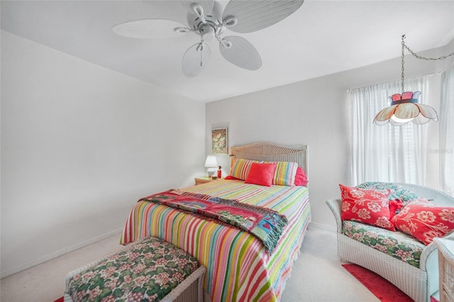 bedroom featuring carpet floors, a ceiling fan, and baseboards