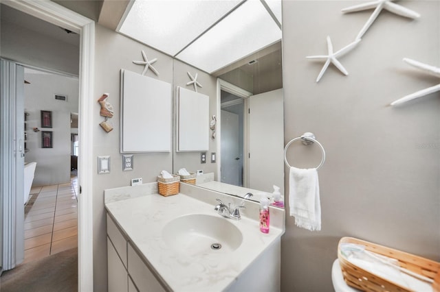 bathroom featuring tile patterned floors and vanity