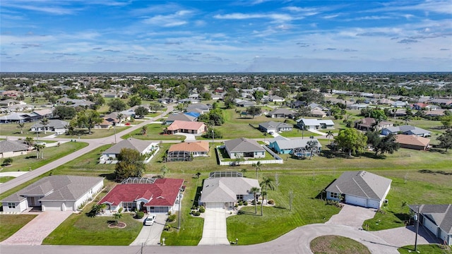 birds eye view of property with a residential view