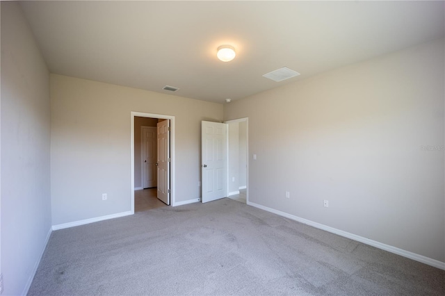 unfurnished bedroom featuring visible vents, baseboards, and carpet flooring