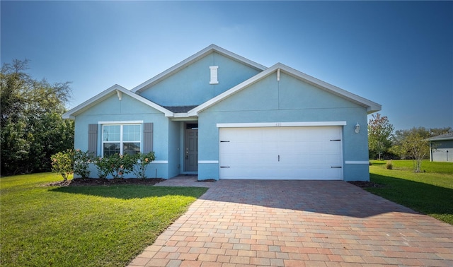 ranch-style house featuring decorative driveway, a front lawn, an attached garage, and stucco siding