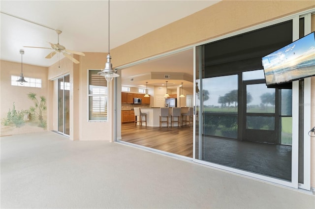 interior space with a ceiling fan