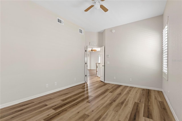 unfurnished bedroom with visible vents, baseboards, and wood finished floors