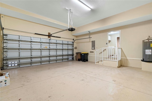 garage featuring electric panel, water heater, and a garage door opener