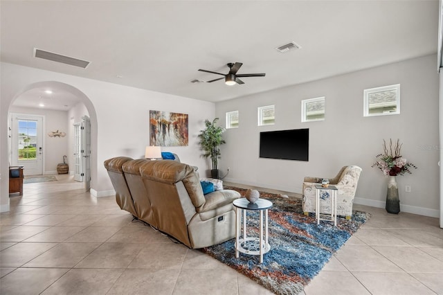 living room with light tile patterned floors and ceiling fan