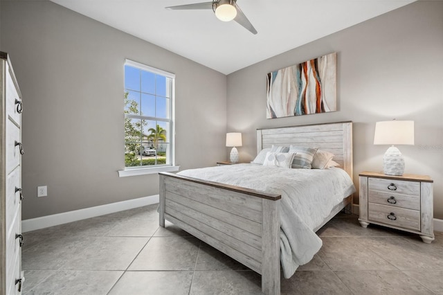 bedroom with ceiling fan and light tile patterned floors